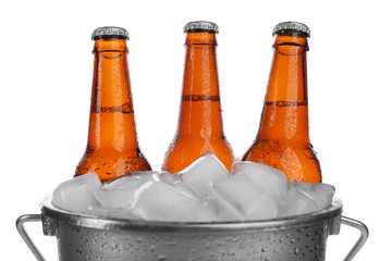 Poster - Beer bottles in ice bucket, isolated on white