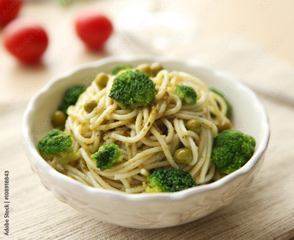Delicious cold pasta salad in bowl on the table closeup
