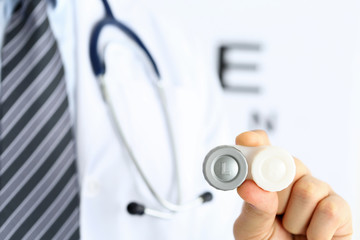 Poster - Male doctor hands giving pair of contact lens in case