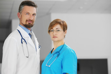 Poster - Male and female doctors in the hospital, indoors