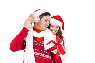 Wall Mural - Festive couple holding christmas gift