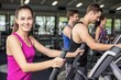 © WavebreakMediaMicro - Fit people on elliptical bike