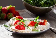 Multigrain Rice Cakes With Strawberries Fruit , Soft Mascarpone Cheese And Arugula For Healthy Breakfast.