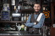 © Dmytro Panchenko - Barman serving cocktail.