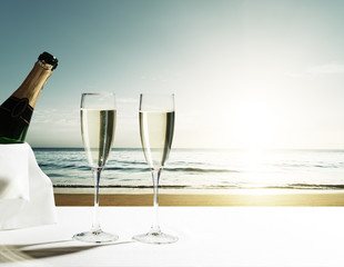 Wall Mural - champaign glasses and sunset on seychelles beach