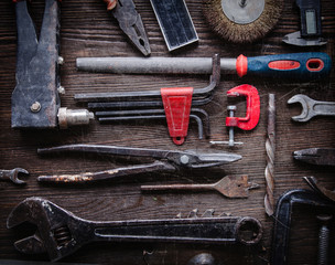 Wall Mural - grungy old tools on a wooden background