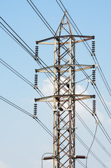 High voltage tower and cable line in sunny day