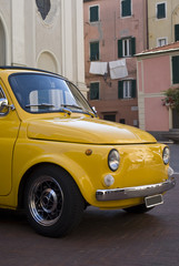 Wall Mural - Classic car parked in a street