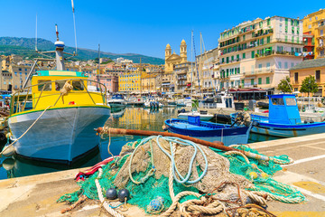 Wall Mural - Traditional fishing boats in Bastia port on sunny summer day, Corsica island, France