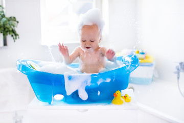 Wall Mural - Little baby taking a bath