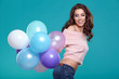 © ZoomTeam - Young pretty woman with colored balloons