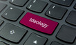 Business Concept: Close-up the Ideology button on the keyboard and have Magenta color button isolate black keyboard