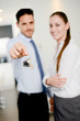 © W PRODUCTION - real estate business agent handing out house key of a new apartment