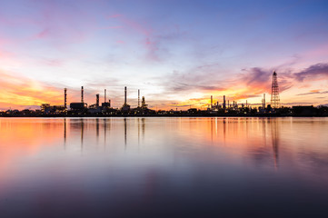 Wall Mural - oil refinery industry plant along twilight morning