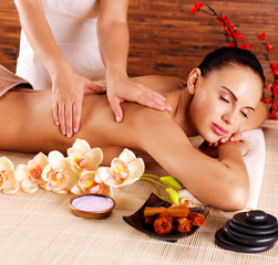 Poster - Masseur doing massage on woman body in spa salon