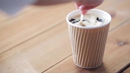 Poster - hand adding and stirring sugar in cup of coffee