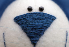 Close-up Of Blue Embroidered Toys Nose