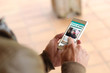 © MclittleStock - Brown young man smartphone social network