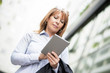 © ivanko80 - Mature businesswoman working on a digital tablet