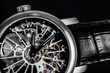 Elegant watch with visible mechanism, clockwork. Time, fashion, luxury concept.