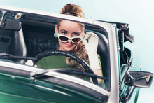 Vintage 1960 Woman In Convertible Car Looking Over Sunglasses.
