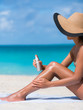 Sunscreen suntan lotion spray skincare product closeup of woman putting tanning oil on legs. Hand holding sunblock or mosquito repellent bottle spraying on body sunbathing at beach summer vacation.