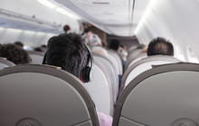 Interior Of Airplane With Passengers