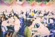 © surasaki - Food Festival with Blurred People Background