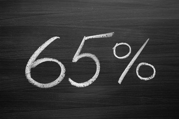 Wall Mural - 65 percent header written with a chalk on the blackboard