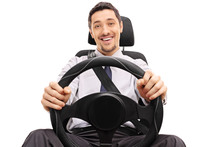Cheerful Guy Holding A Steering Wheel
