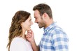 © WavebreakMediaMicro - Happy young couple looking at each other and smiling