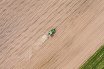 aerial view of the tractor on the harvest field