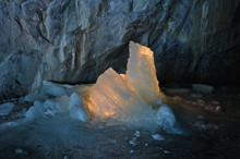 Ice Stalagmites Illuminated By Candles Inside The Marble Mine. Ruskeala, Karelia, Russia.