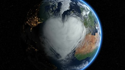 sunrise over earth with a big heart shaped cloud. earth in hands. clip contains hearts, earth, space