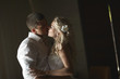 © Dmitry Yakunin - Beautiful young couple kissing with emotional embrace.