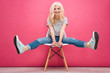 © Drobot Dean - Funny blonde woman sitting on the chair