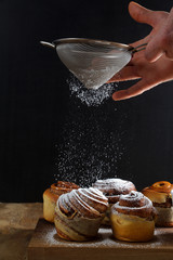 sprinkle with powdered sugar sweet rolls. morning breakfast