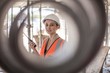 © Connect Images - Portrait of female builder on construction site