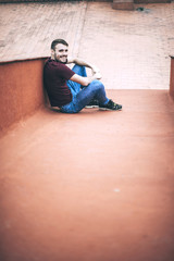 Wall Mural - Handsome caucasian young man in casual clothes in urban environm