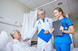 © Syda Productions - doctor and nurse visiting senior woman at hospital
