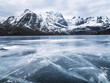 © Johnér - Frozen water and mountain range on background