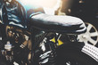 © iana_kolesnikova - Close-up of vintage custom cafe-racer outdoors, sunlight, filtered image