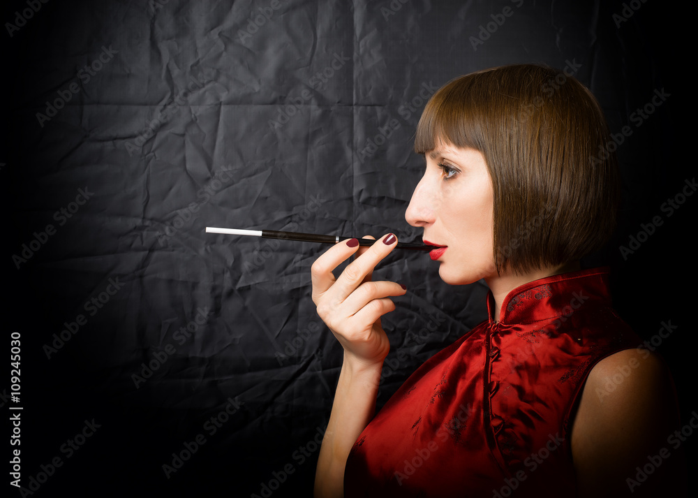 woman with a cigarette holder Stock Photo