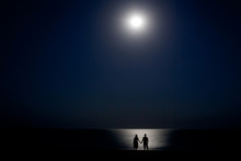 Couple On The Shore At Night In The Moonlight