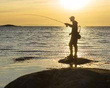 Silhouette Of Man Fishing