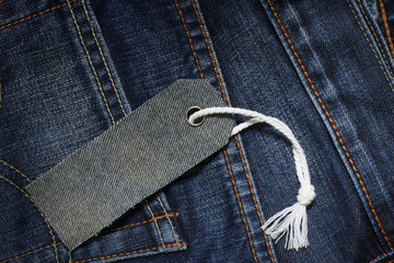 tag price on jeans texture background