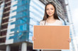 © fotofabrika - Young dark hair woman keeping cork board