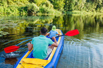 Family kayaking on the river