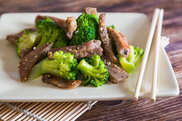 Canvas Print - Asian cuisine, grilled meat with broccoli and sesame