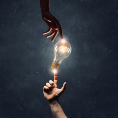Wall Mural - hand pointing light bulb